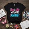 Just A Girl Who Loves Anime text design on a black t-shirt with pink and blue lettering and small hearts