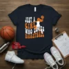 Just A Girl Who Loves Basketball text design with a silhouette of a girl playing basketball, orange and white font
