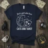 T-shirt design featuring a cat on a crescent moon with tarot cards, text reads "Just a girl who loves CATS