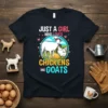 T-shirt design with text "JUST A GIRL WHO LOVES CHICKENS AND GOATS" featuring a cartoon goat and chicken graphic