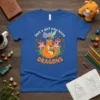 Just a girl who loves DRAGONS t-shirt design with an orange dragon, fairy, and mushrooms