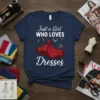 Just a Girl WHO LOVES Dresses text with a red ball gown, high heels, necklace, and handbag graphic on a