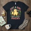 Just A Girl Who Loves Ducks text with a mother duck and ducklings graphic on a dark t-shirt