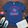 Just A Girl Who Loves Football text with a pink and blue soccer ball graphic on a royal blue t-shirt