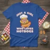 T-shirt featuring the text "Just A Girl Who Loves Hotdogs" with a cartoon girl chef holding a hotdog