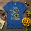 JUST A Girl who loves SUNFLOWERS text with a sunflower graphic on a royal blue t-shirt, perfect for nature lovers