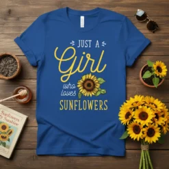 JUST A Girl who loves SUNFLOWERS text with a sunflower graphic on a royal blue t-shirt, perfect for nature lovers