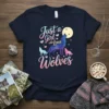 Just a Girl Who Loves Wolves text with geometric wolf family graphic on a navy t-shirt