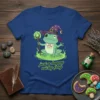 Just a happy wichy frog t-shirt design with a cartoon frog wearing a witch hat and holding a crystal staff