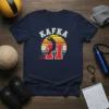 Kafka 11 volleyball player design with retro sunset graphic and distressed text, presented on a navy t-shirt