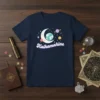 Kaikamahine t-shirt with a crescent moon, planets, and stars in a retro celestial design