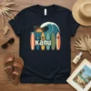 Kanu retro surfboard graphic t-shirt design featuring surfboards, ocean wave, and sunset