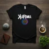 Black t-shirt with white "Karma" text and a colorful circular logo with a balance scale graphic