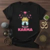 Karma t-shirt design with meditating silhouette, lotus flower, hearts, and pink text