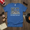 KC two states one town t-shirt with Kansas City skyline graphic in gray and white on blue fabric