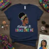 Kebanjji B. Looks Like Me t-shirt design featuring a Black woman with a colorful headwrap and statement text