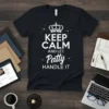 Keep Calm And Let Patty Handle It text design with crown graphic and sparkles on a black t-shirt