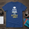 Keep Calm and Study On text with graduation cap and open book graphic on a blue t-shirt