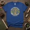 Keep Midlothian Beautiful T-Shirt featuring a circular design with a tree, flowers, and oil derricks, promoting local pride