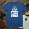Keep Public Lands Public slogan tee with mountain and stars graphic, bold white text on blue shirt