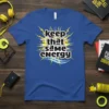 Blue t-shirt with the bold white text "keep that same energy" surrounded by yellow lightning bolts