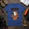 Keep Your Chin Up motivational quote t-shirt with graphic of a person looking upwards, surrounded by arrows and sunburst