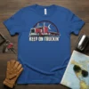 Keep On Truckin' t-shirt design featuring a red semi-truck under a crescent moon and stars, with bold white text
