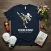Kicking Blooms Strength & Grace t-shirt featuring a silhouette of a woman performing a high kick, adorned with colorful flowers