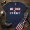 Kid Rock for U.S. Senate T-Shirt in navy blue with bold white and red text. Features a star graphic
