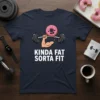 Kinda Fat Sorta Fit funny gym t-shirt design featuring a cartoon donut lifting weights