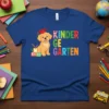 Kinder Garten text with a cute golden retriever puppy wearing a graduation cap on a royal blue t-shirt