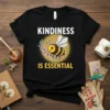 Kindness Is Essential quote with a cute bee on a black t-shirt, promoting positivity and kindness