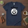 Navy t-shirt with "Kindness Kindness" text and a graphic of hands holding a plant with heart leaves and a bird