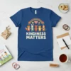 Kindness Matters T-Shirt with cartoon fox, bunny, bear, cat, and dog holding hands under a rainbow