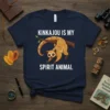 Kinkajou is my spirit animal text with a cute cartoon kinkajou hanging on a branch, navy blue t-shirt design