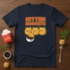 Kitten Nuggets text with cute cat-shaped food nuggets dipping in chocolate sauce on a navy t-shirt