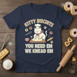 Cute cat baker wearing a chef hat kneading dough with text "Kitty Biscuits You Need Em We Knead Em" and