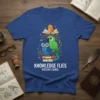 Knowledge Flies Wisdom's Wings t-shirt design with owl, parrot, and chick on books, featuring inspirational quote