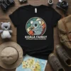 Koala Family Australian Outback Adventures t-shirt featuring a mother koala holding a baby koala, with text and a retro circle