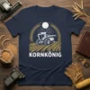 Kornkönig text with a combine harvester in a wheat field on a navy t-shirt