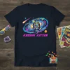 Kozmik Kitten astronaut cat design on a navy t-shirt, set against a vibrant galaxy backdrop