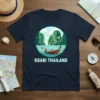 Krabi Thailand text design with a longtail boat and limestone karsts in a circular graphic on a navy t-shirt