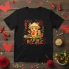 Black t-shirt with a cute cartoon bull wearing a conical hat, holding a red envelope, with "Lì Xì Me Please"