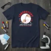 Laboratory Phlebotomist T-Shirt featuring red text "Laboratory" around a circle with hands drawing blood into a test tube, and "phlebotomist"