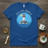 Ladies of the Lighthouse t-shirt design featuring a lighthouse on rocks in the ocean with seagulls and sun, text "Canyon