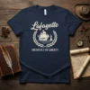Lafayette Architect of Liberty t-shirt design featuring a ship and Statue of Liberty within a laurel wreath
