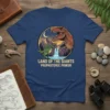 Land of the Giants Prephstoric Power T-Shirt featuring T-Rex and Spinosaurus with waterfall and mountains under a moonlit sky