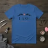 Blue t-shirt with "LASH THERAPIST" text and eyelashes graphic, ideal for lash technicians