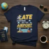 Navy t-shirt with yellow and white text "LATE EVERYWHERE BUT THE AIRPORT" and an airport graphic