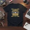 Black t-shirt with "LAUREA MAGISTRALE 2026" text, graduation cap, and open books graphic in gold